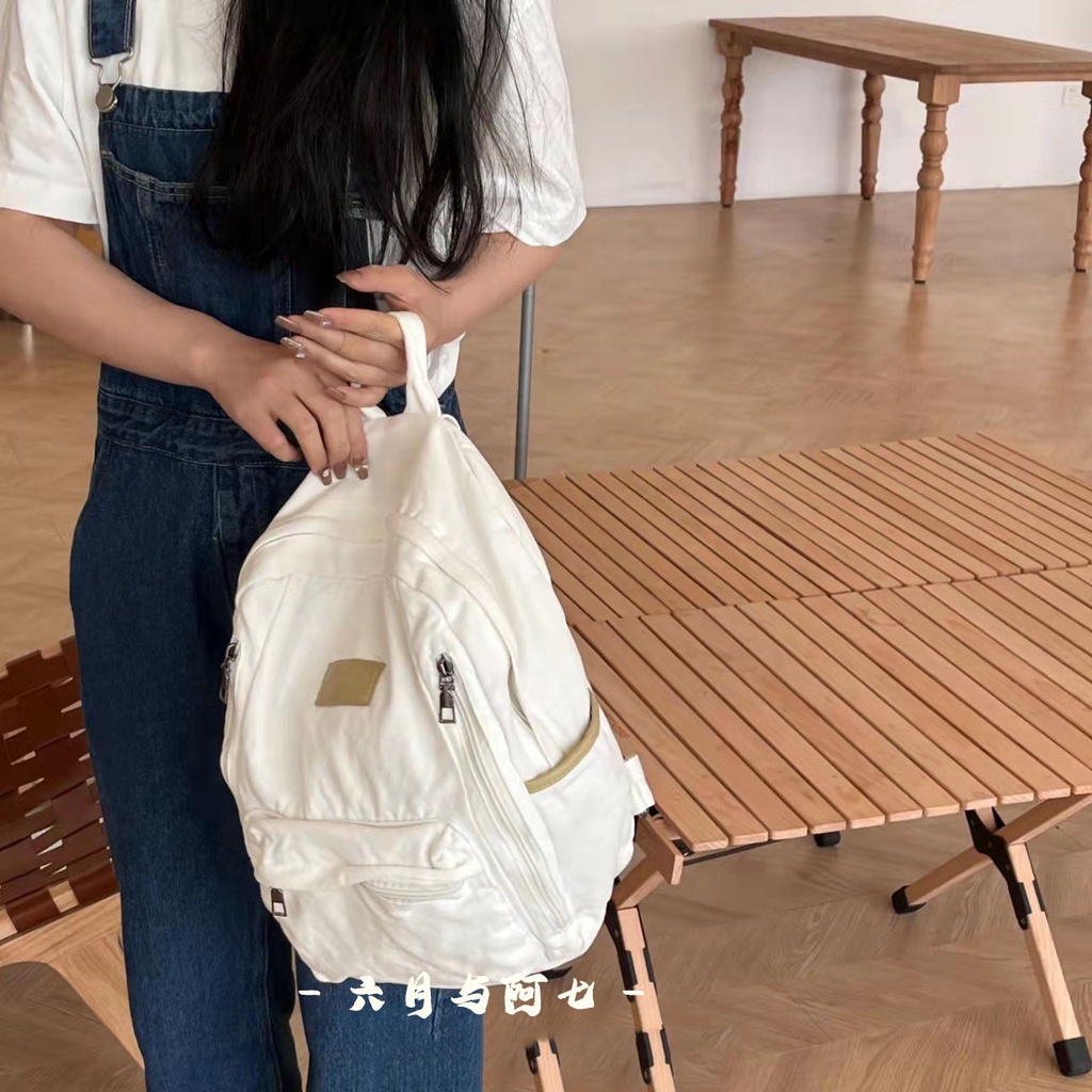 ✒♝Sera Sera diimpor perguruan tinggi Jepang gaya malas tua dicuci putih kanvas tas sekolah siswa gaya sederhana liontin putih ransel kanvas