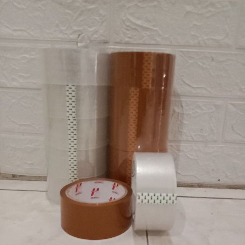 

Lakban/solasi/tape bening coklat ukuran lebar 45 mm panjang 90 yard