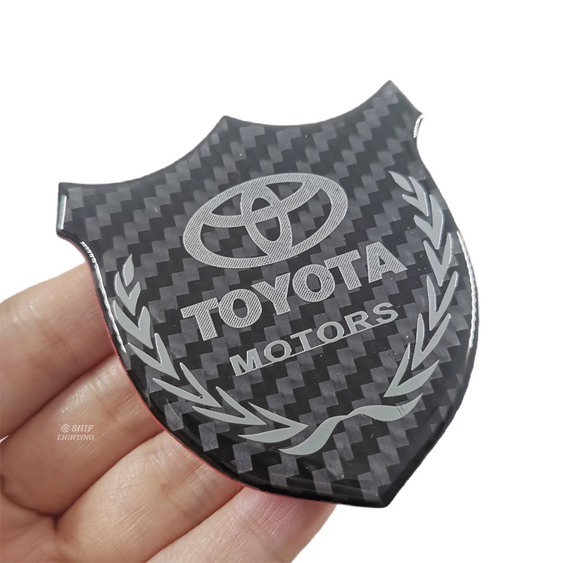 1pc Stiker Emblem Logo TOYOTA MOTORS Bahan Karbon Fiber Untuk Dekorasi Jendela Samping Mobil