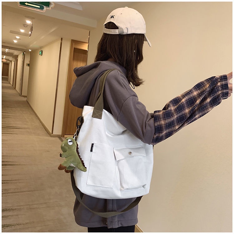 ₪❖∏Sera tas kanvas besar tas wanita baru 2022 versi Korea dari kelas siswa tas jinjing portabel tas bahu tas kurir pasang