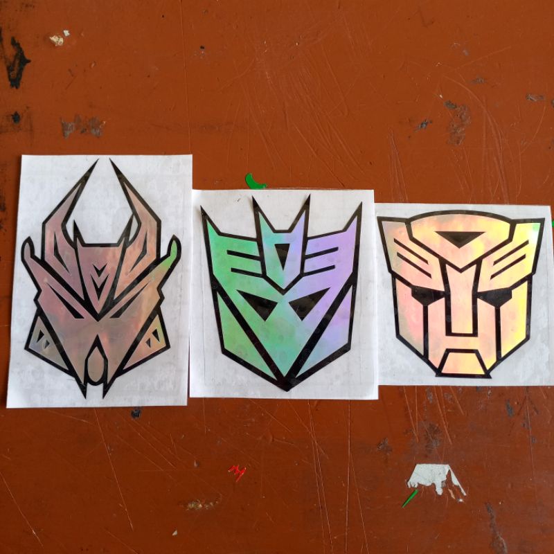 stiker hologram pelangi logo transformers