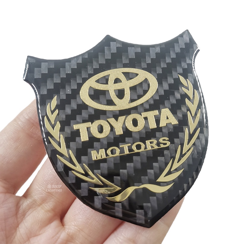 1pc Stiker Emblem Logo TOYOTA MOTORS Bahan Karbon Fiber Untuk Dekorasi Jendela Samping Mobil