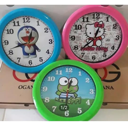 Jam dinding karakter merk ogana hello kitty doraemon keropi
