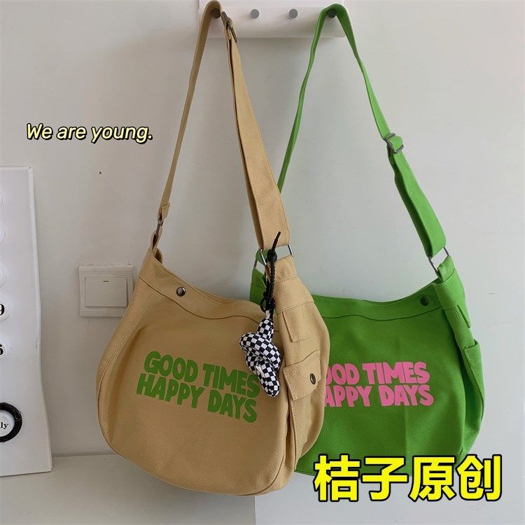 ✢✺✸Tas komuter Jepang in letter printing niche girl all-match canvas bag student class tas messenger berkapasitas besar