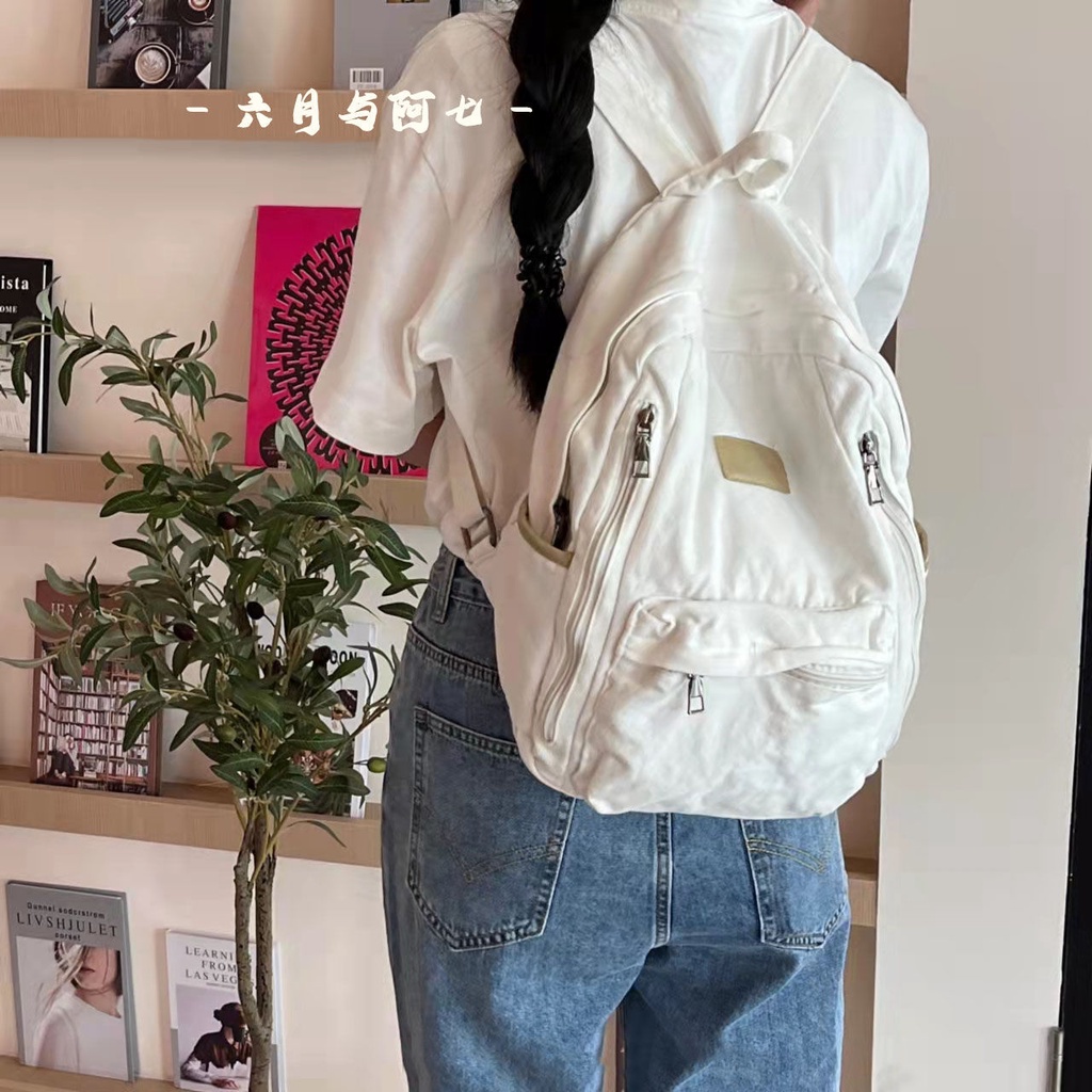 ✒♝Sera Sera diimpor perguruan tinggi Jepang gaya malas tua dicuci putih kanvas tas sekolah siswa gaya sederhana liontin putih ransel kanvas