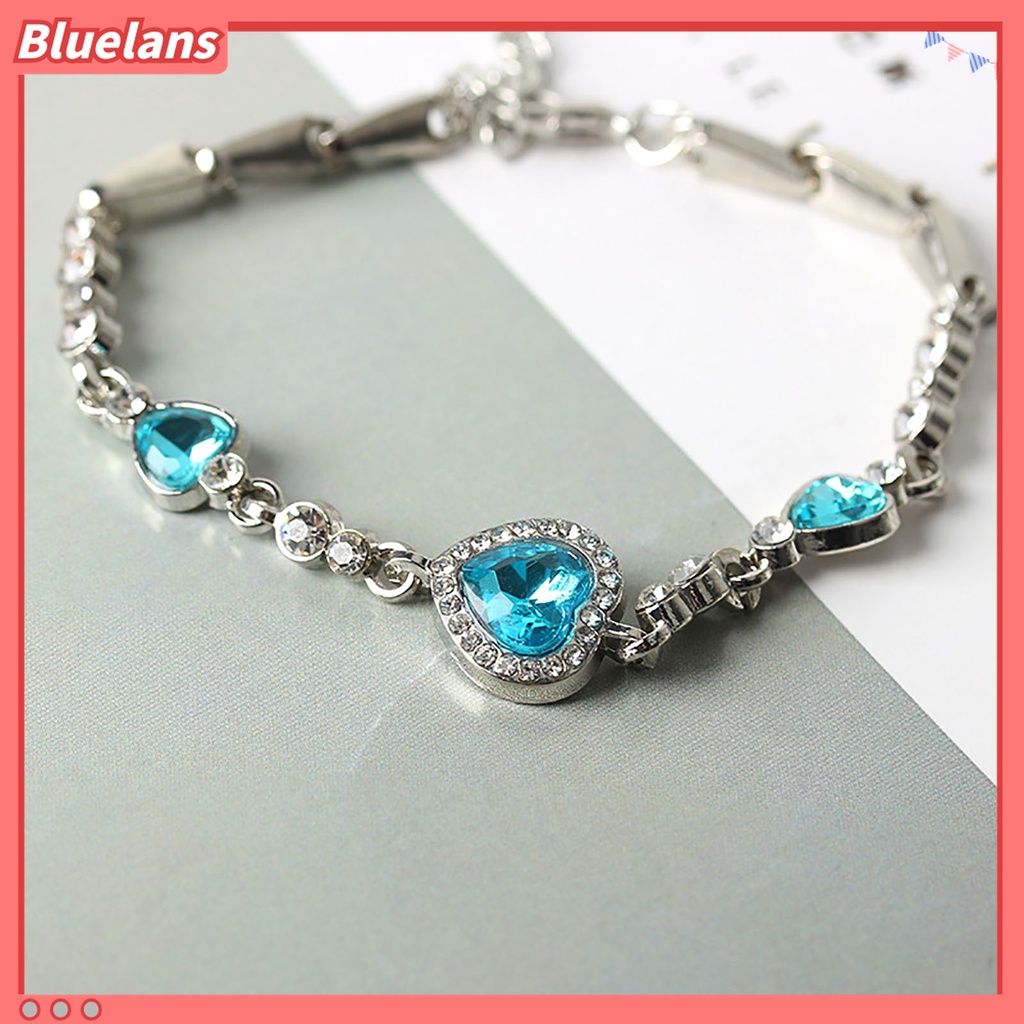 Gelang Rantai Adjustable Bentuk Hati Aksen Berlian Imitasi Warna Biru Bahan Alloy Untuk Wanita