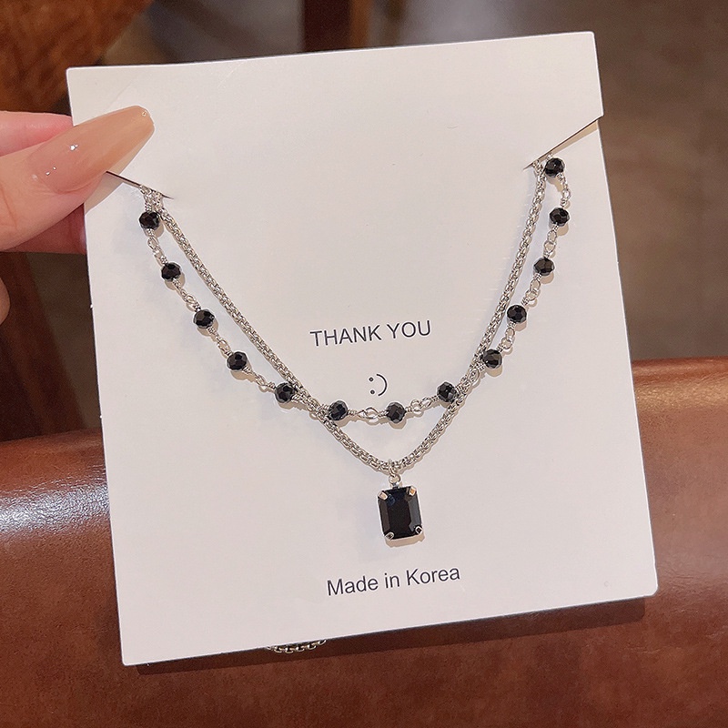 Kalung Bahan Titanium Aksen Kristal Warna Hitam Untuk Wanita