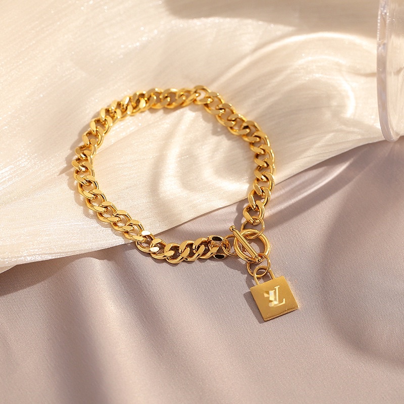 gelang titanium sisik naga lv cantik