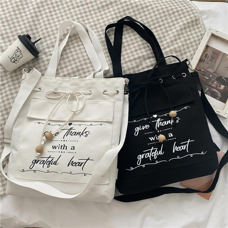 ✌✳Sera 2022 baru tas kanvas siswa perempuan tas bahu satu bahu versi Korea sastra tas messenger sederhana dan serbaguna