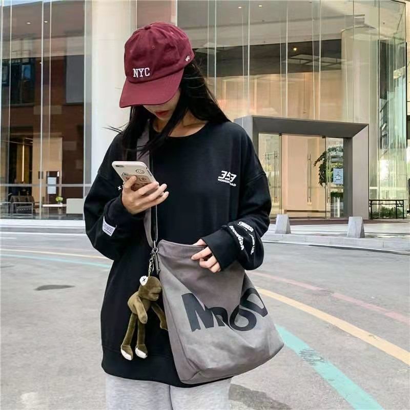 ✉﹉✎Sera bag wanita 2021 populer kapasitas besar tas kanvas siswa ransel utusan sederhana dan serbaguna tas pasangan gaya malas