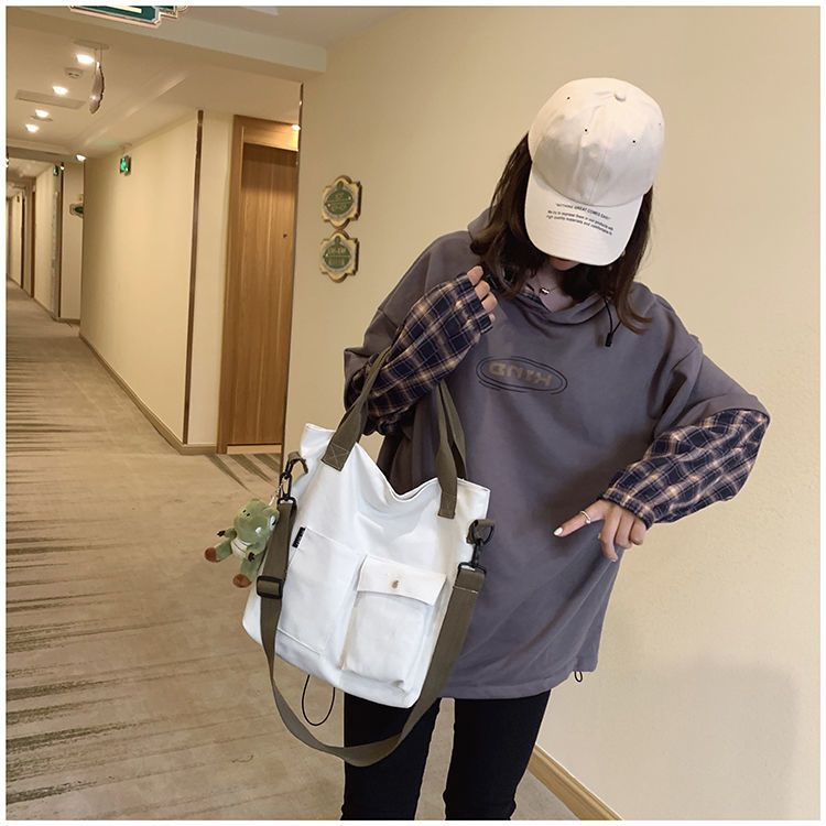 ₪❖∏Sera tas kanvas besar tas wanita baru 2022 versi Korea dari kelas siswa tas jinjing portabel tas bahu tas kurir pasang