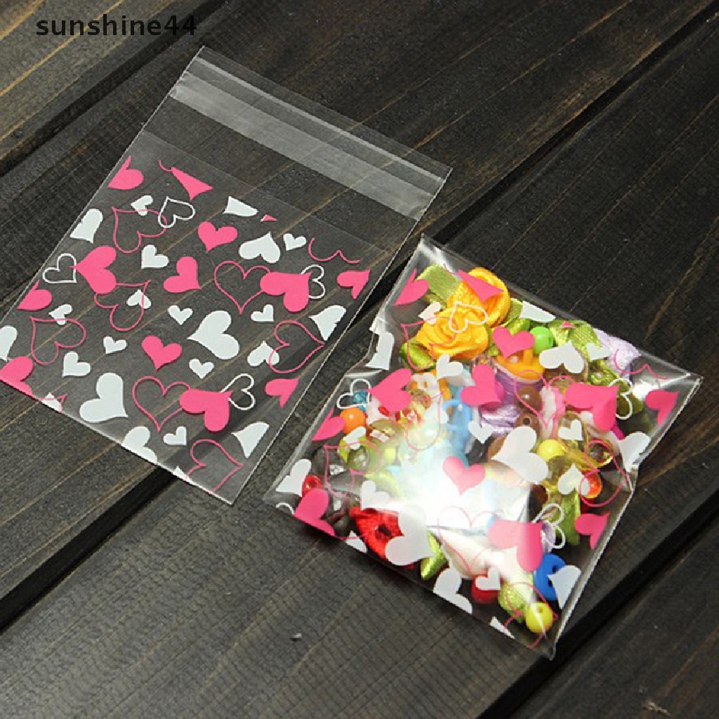 Sunshine 100pcs / Set Mainan Hati Manis Untuk Anak Kantong Plastik Kemasan Kue / Permen / Biskuit DIY Dengan Perekat Untuk Suvenir