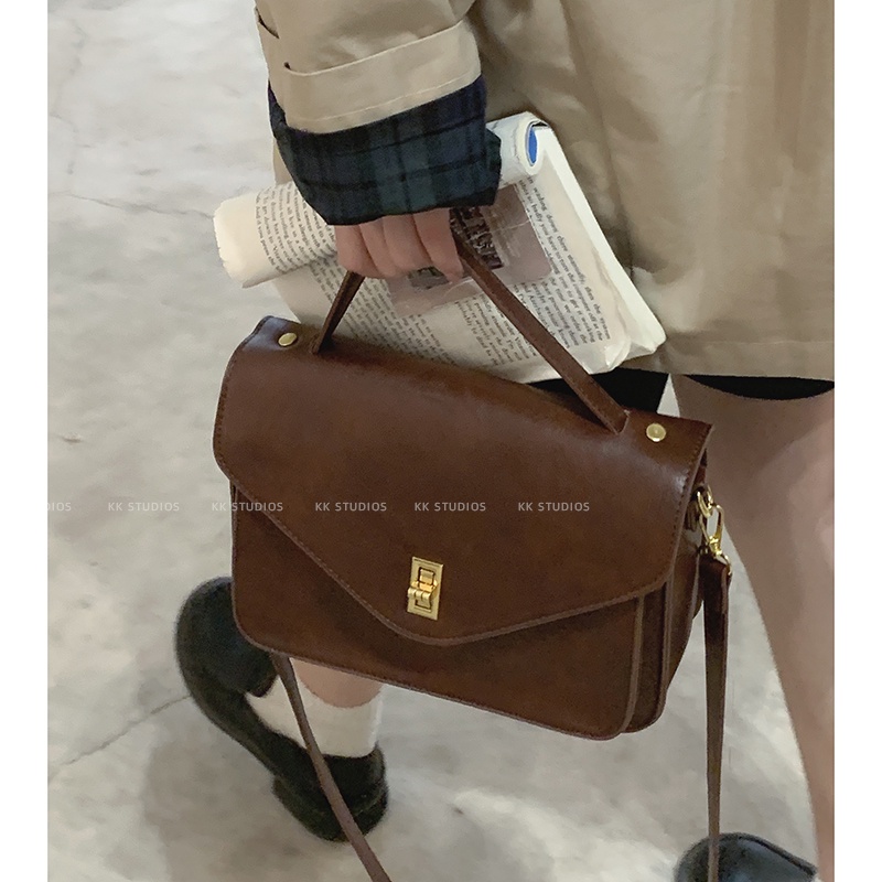 Suhao retro messenger bag perempuan 2022 baru tas kerja portabel fashion trendi semua pertandingan mahasiswa tas messenger berkapasitas besar