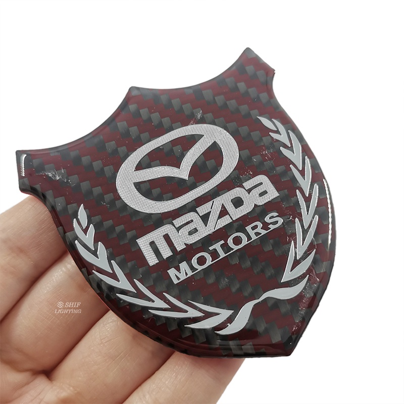 1pc Stiker Emblem Logo MAZDA MOTORS Bahan Karbon Fiber Untuk Dekorasi Jendela Samping Mobil MAZDA