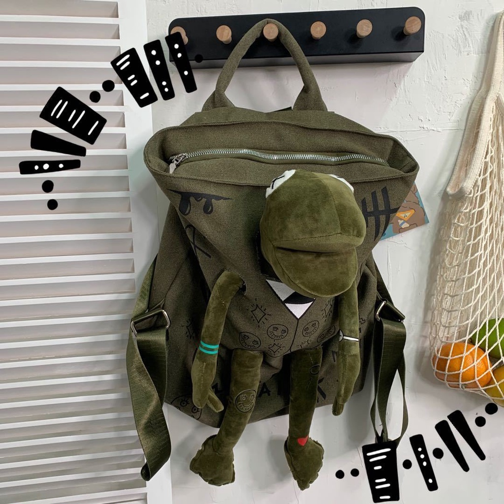 ✘♘✆Sera Jepang Street Cool Graffiti Seri Ransel Kanvas Gaya Hong Kong Sastra Katak Merek Tas Sekolah Boneka