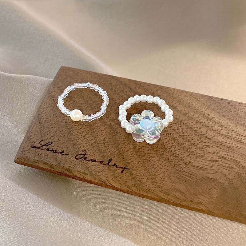 Set Cincin Adjustable Desain Bunga Aksen Mutiara Warna Transparan