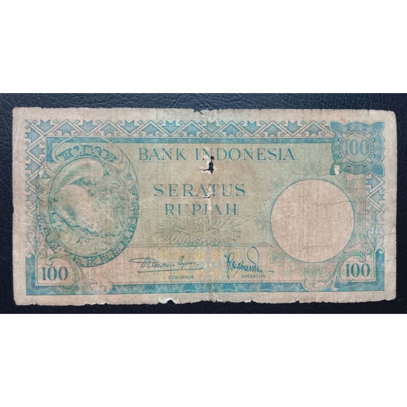 UANGKUNO 100 RUPIAH TUPAI THN 1957