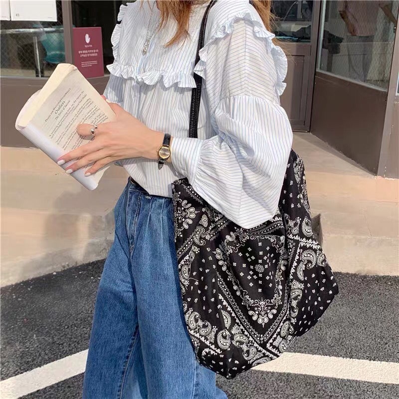 ✲Korea ins niche Kong Xiaozhen dengan bunga mete yang sama satu bahu messenger tas kanvas tas kanvas retro fashion kasual