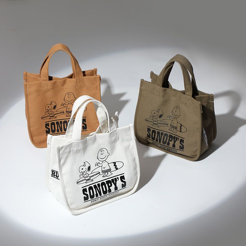 ✣▩◄Sera Jepang baru Snoopy snoopy lucu tas kanvas tas tangan, Isolasi siswa tas makan siang, Versi Korea tahan