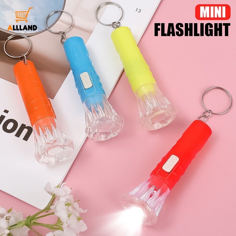 1pc Mainan Senter LED Mini Tenaga Baterai Kancing Bahan Plastik Warna Acak Dengan Gantungan Kunci Untuk Anak