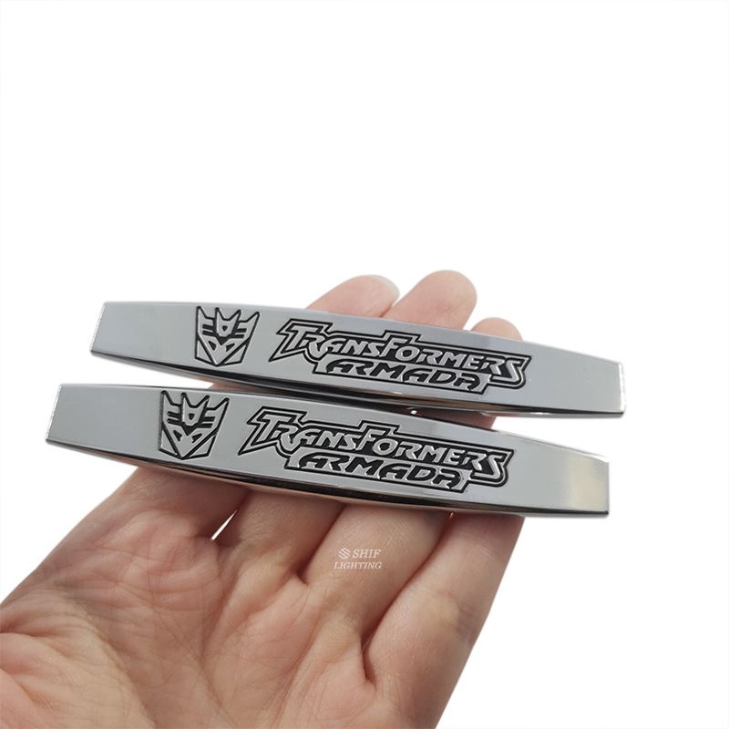 2pcs Stiker Emblem Logo Transformer Bahan Metal Untuk Dekorasi Mobil / Motor / Sepeda