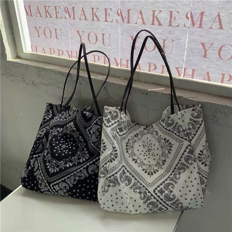 ✲Korea ins niche Kong Xiaozhen dengan bunga mete yang sama satu bahu messenger tas kanvas tas kanvas retro fashion kasual