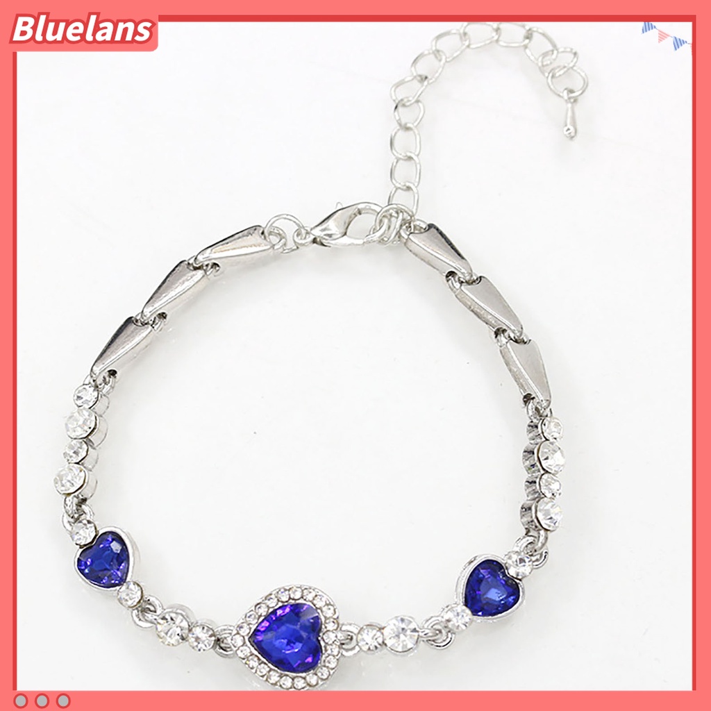 Gelang Rantai Adjustable Bentuk Hati Aksen Berlian Imitasi Warna Biru Bahan Alloy Untuk Wanita