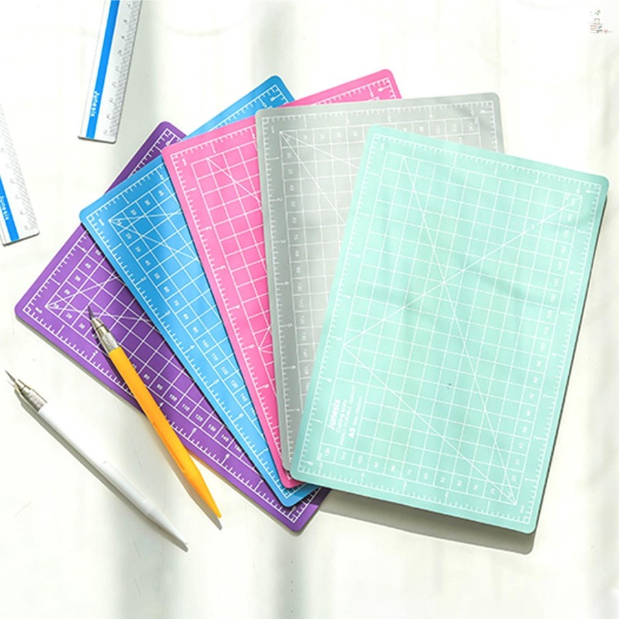 

Alas Cutting Mat Papan Board Bahan PVC Ukuran A5 RANDOM Merk JOYKO Alas Pemotong Kertas Work Cutting Mat Pad Good Quality Murah Peralatan Perlengkapan Kantor Papan Memotong Murah Termurah Top Seller Products Blimbing Indah Sablon Malang