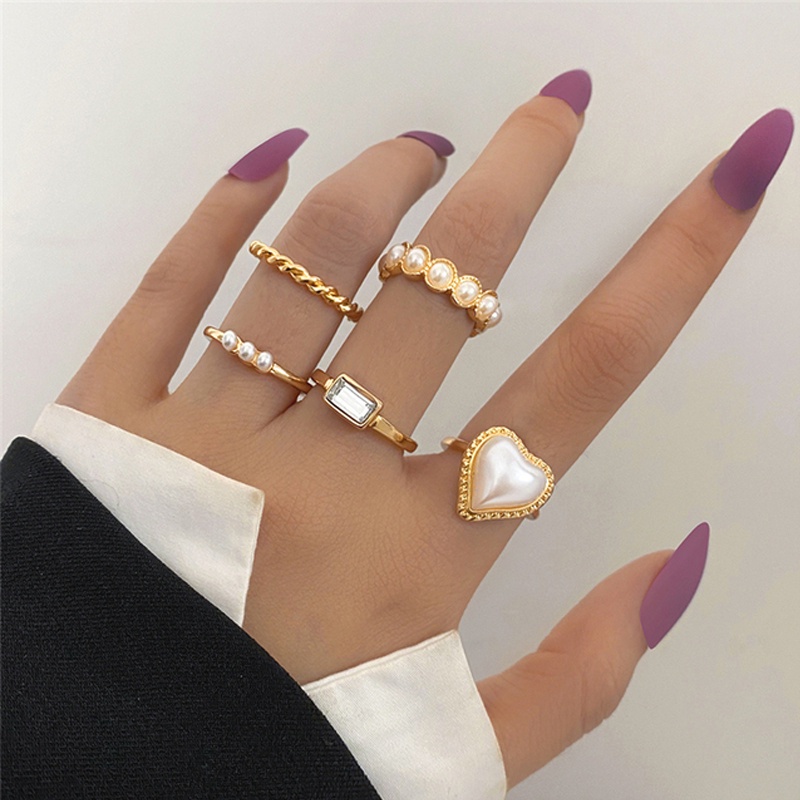 Set Cincin Bentuk Bunga Geometris Aksen Mutiara Bahan Metal Warna Emas Untuk Wanita