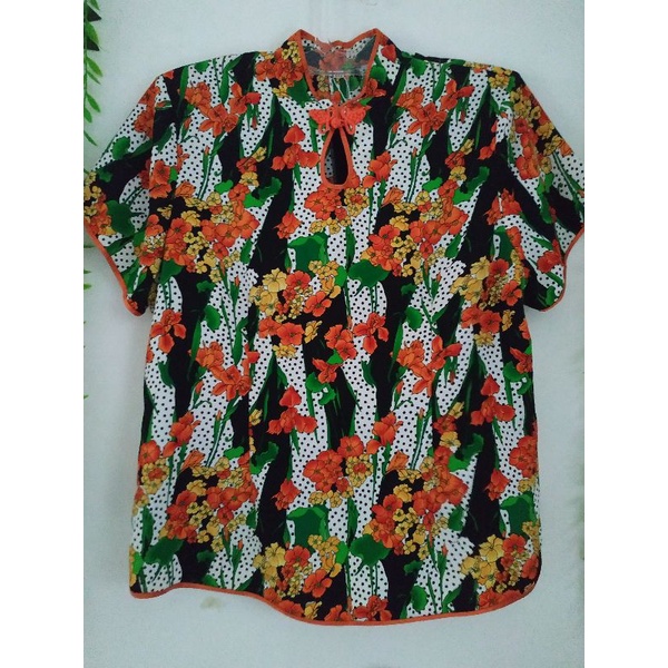 Blouse bunga" orens, lengan pendek
