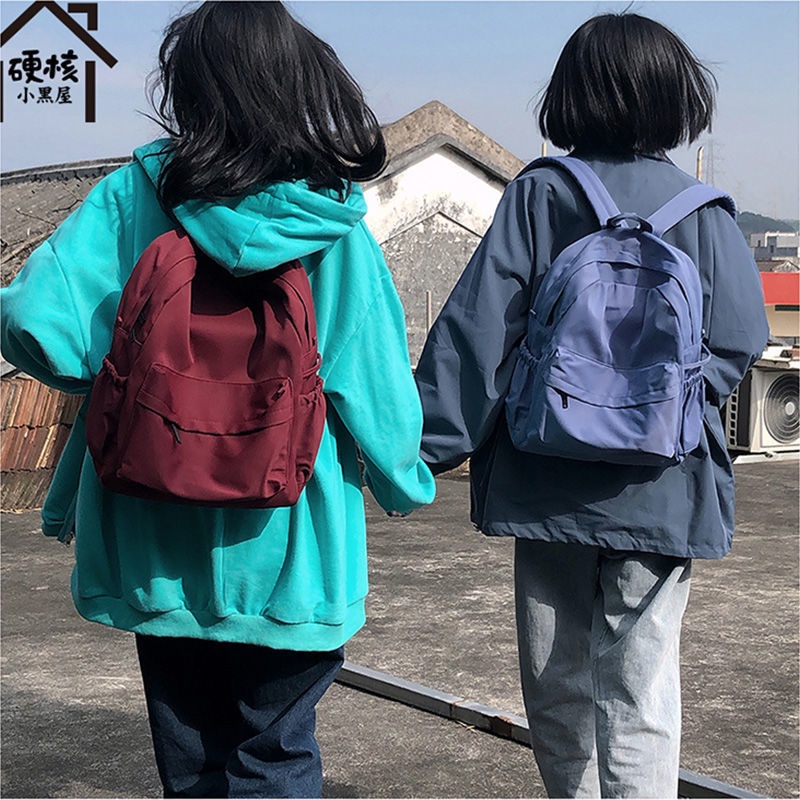 Tas sekolah wanita versi Korea warna solid kecil segar sekolah tinggi siswa ransel kampus di departemen Fengsen ransel sederhana wanita