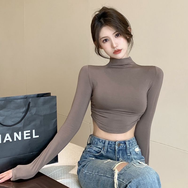 Suhao lipit bahu depan lengan panjang t-shirt wanita bottoming warna solid tipis dan pendek retro pusar atas tidak teratur kerah tinggi musim gugur dan musim dingin