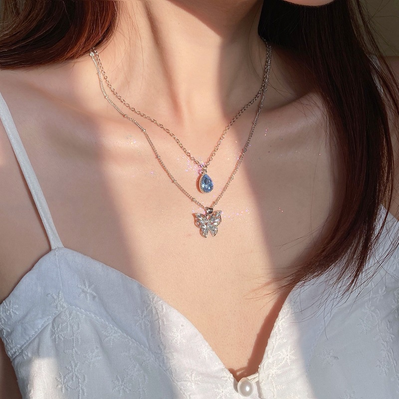 Kalung Rantai Klavikula Desain Kupu-Kupu Water Drop Bahan Zirkon Warna Biru Untuk Aksesoris