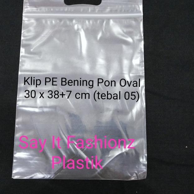 

Kantong Plastik Klip Pon Oval PE Bening 30x38+7cm tebal 05 isi 100lbr