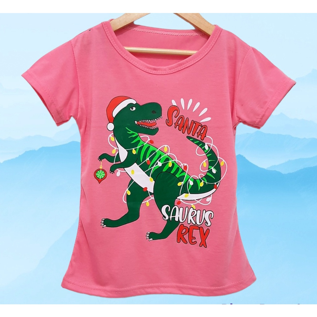 Kaos natal anak perempuan atau laki-laki motif trex santa lengan pendek  bahan lembut dan adem/ Kaos natal anak dinosaurus trex santa terbaru harga murah