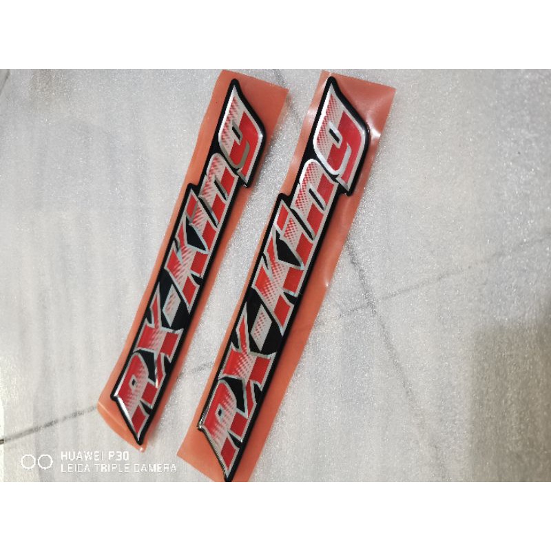 EMBLEM BOX AKI RX KING 3004-2005 ORIGINAL SEPASANG