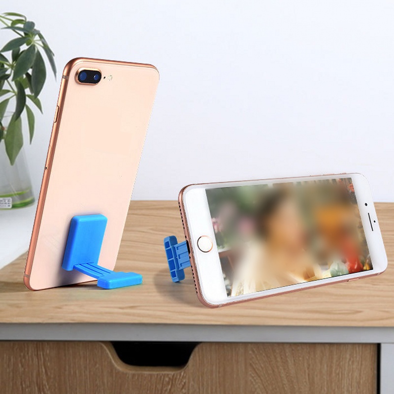 1pc Stand Holder Ponsel Universal Mini Portabel Dapat Ditarik Warna Permen Bahan Plastik Untuk Meja