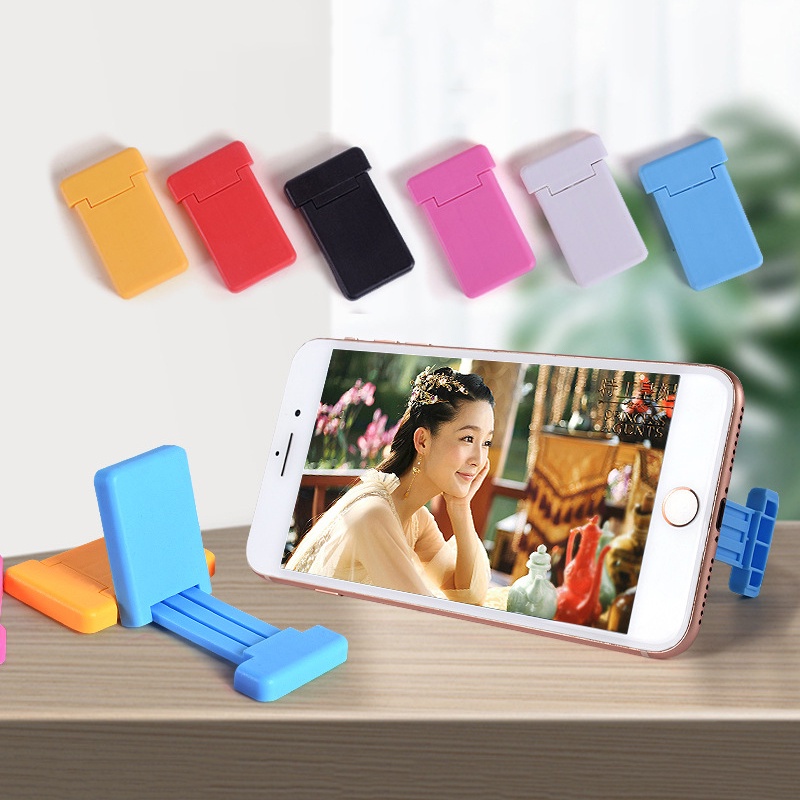 1pc Stand Holder Ponsel Universal Mini Portabel Dapat Ditarik Warna Permen Bahan Plastik Untuk Meja