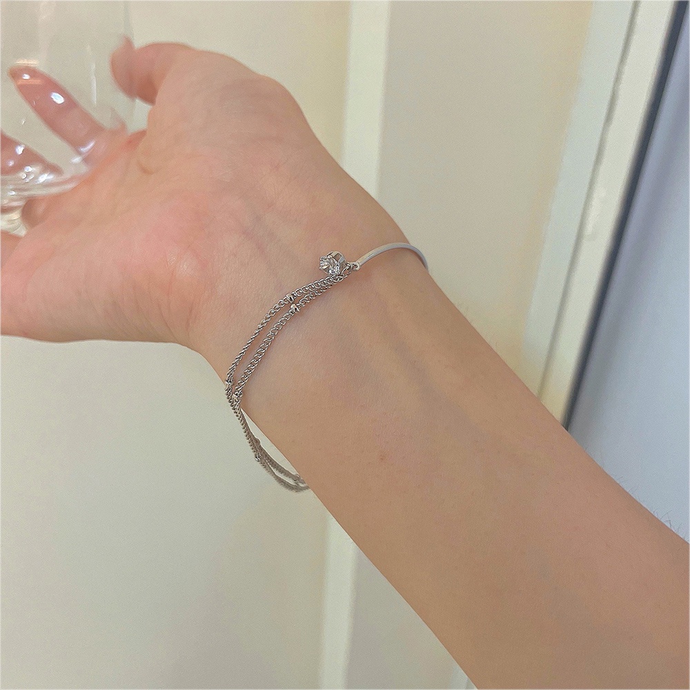 Gelang Rantai Liontin Zircon Asimetris Bahan Titanium steel Warna Silver Untuk Wanita