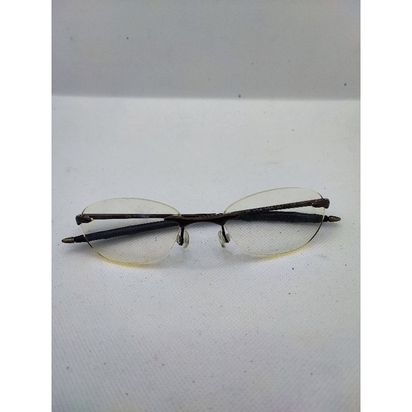 kacamata frameless merk okley 1 frame less
