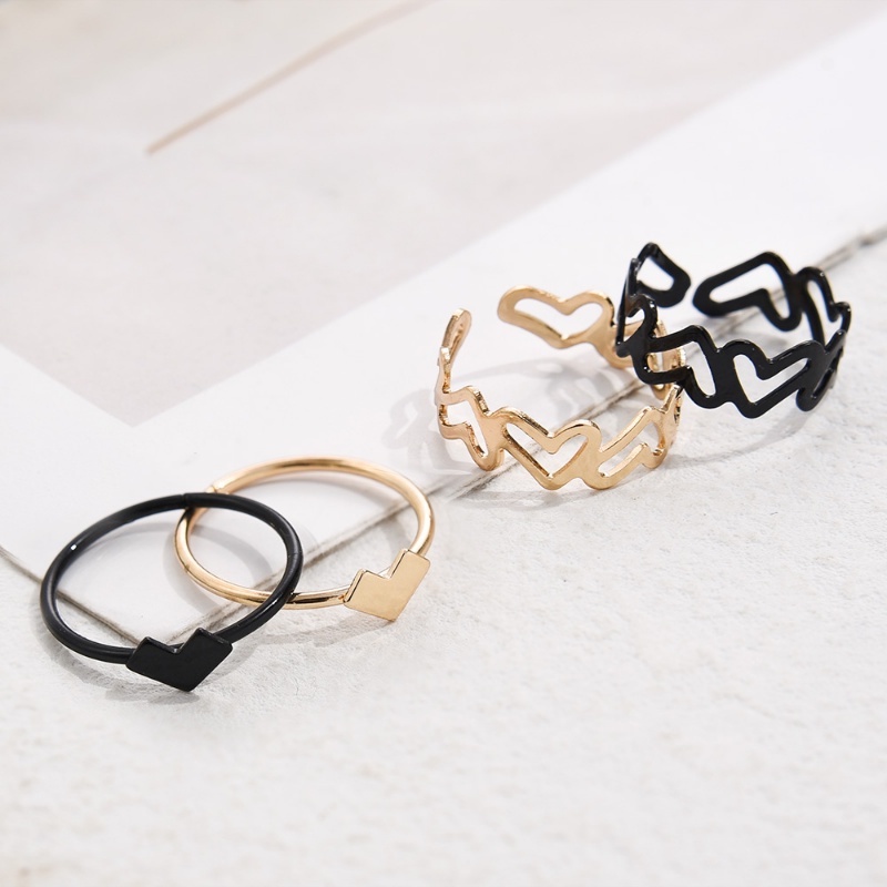 Set Cincin Bentuk Hati Model Hollow Bahan Metal Warna Hitam Gaya Korea Untuk Pasangan