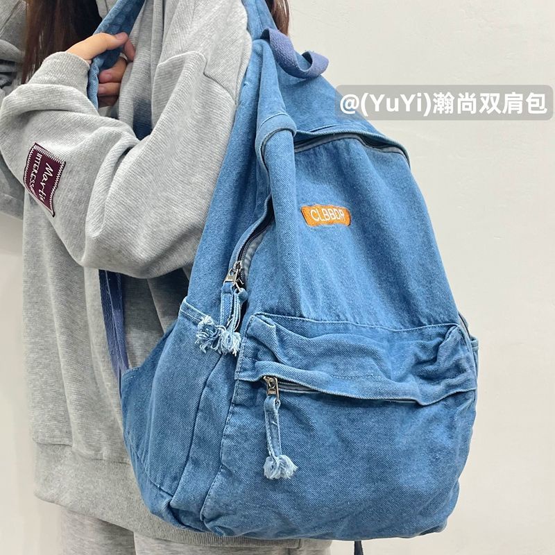 Sera mahasiswa Amerika high street retro denim ransel tua dicuci tas sekolah malas siswa ransel untuk pria dan wanita