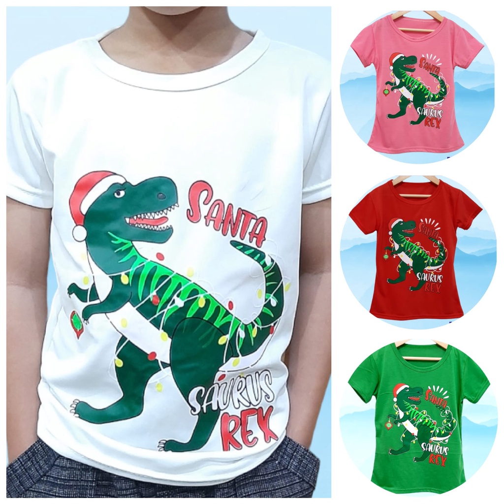 Kaos natal anak perempuan atau laki-laki motif trex santa lengan pendek  bahan lembut dan adem/ Kaos natal anak dinosaurus trex santa terbaru harga murah