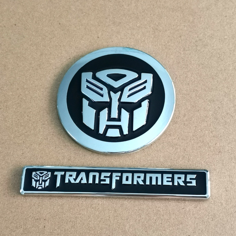 1pc Stiker Emblem Transformers TF 3D Bahan Metal Warna Hitam Untuk Mobilmotortruk