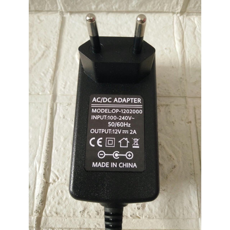 AC/DC ADAPTER  12V 2A model: OP-1202000 Jek DC 5.5mm X 2.1mm - 2.5mm