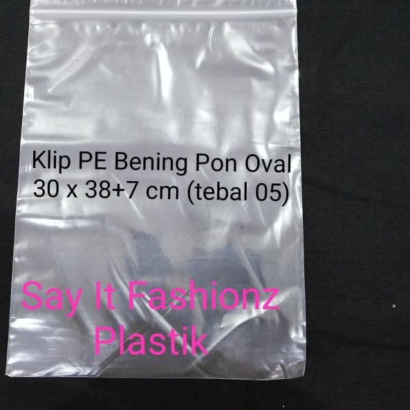 

Kantong Plastik Klip Pon Oval PE Bening 30x38+7cm tebal 05 isi 100lbr