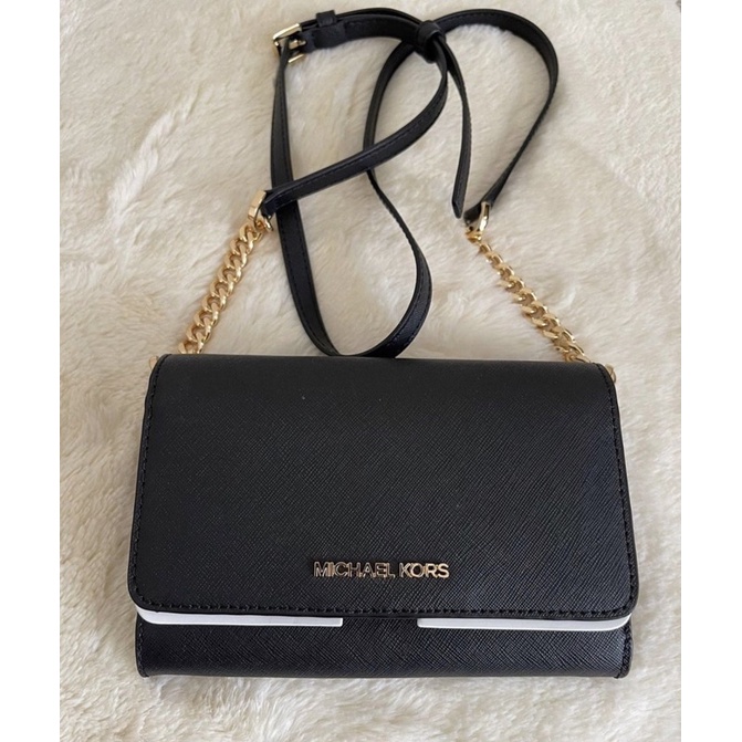 pelunasan mk jet set phone crossbody