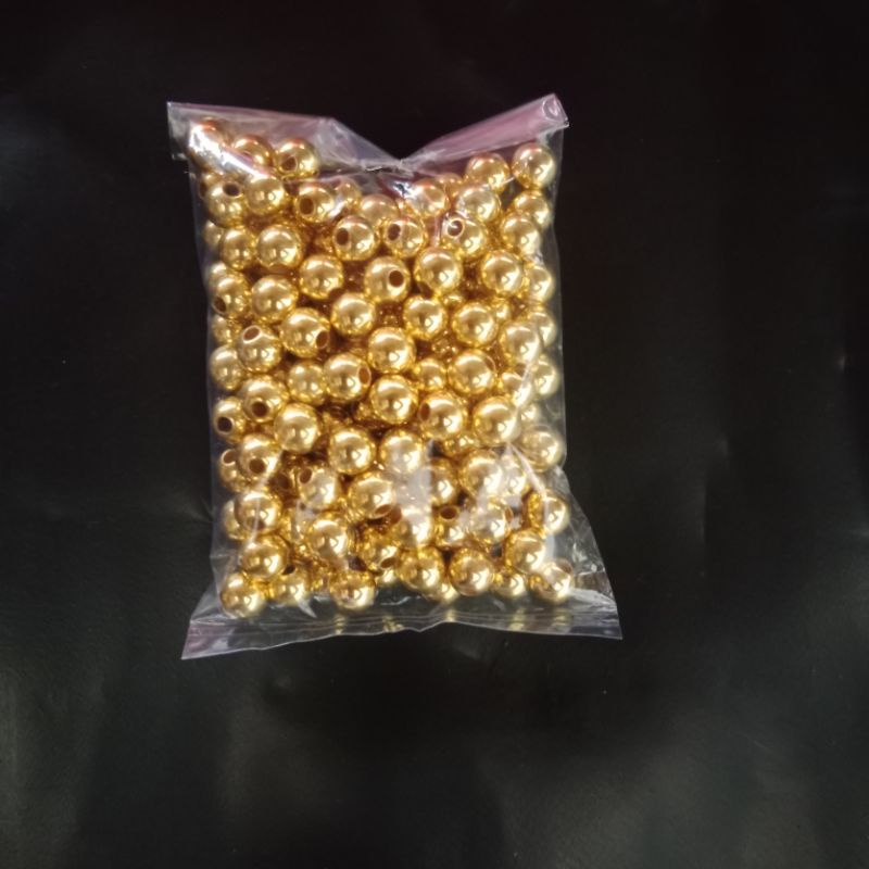 Mutiara berlubang/mutiara kalung warna emas/perak ( harga/50 gram.)