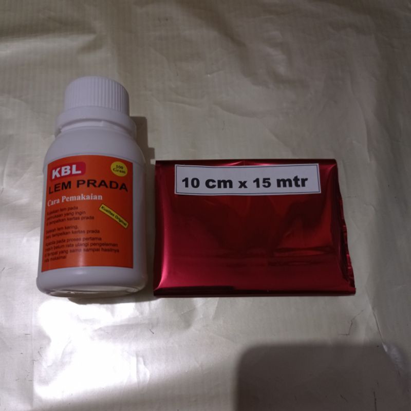 

Lem glue adhesive lem foil KBL 100 gram + foil prada merah drark red 10 cm x15 mtr mudah di kleteknya kuat dan tahan lama paket