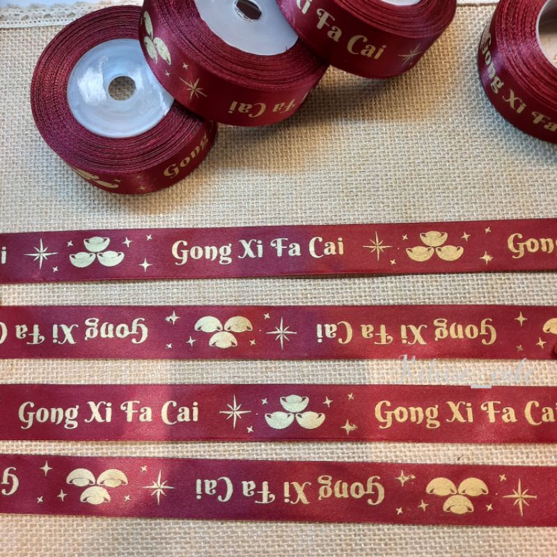 

PITA CNY/SINCIA/IMLEK/CHINESE NEW YEAR WRN MERAH MAROON UKR 2,5 CM PANJANG 18 METER